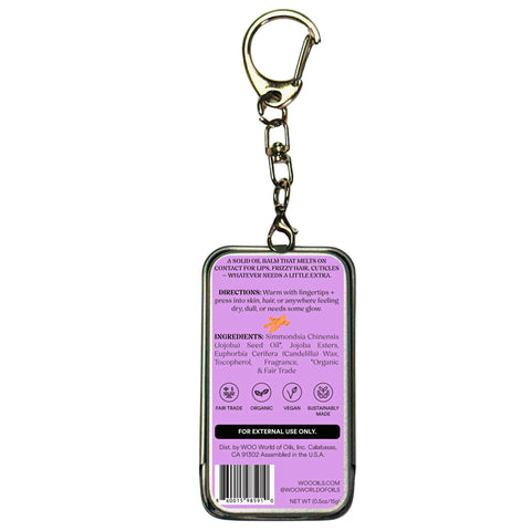 Purple oil balm tin with keychain clip