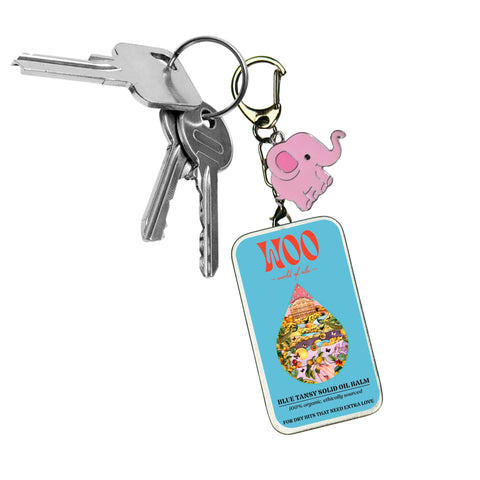 Keys with pink elephant charm and product tag