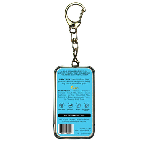Metal keychain tin with blue balm label