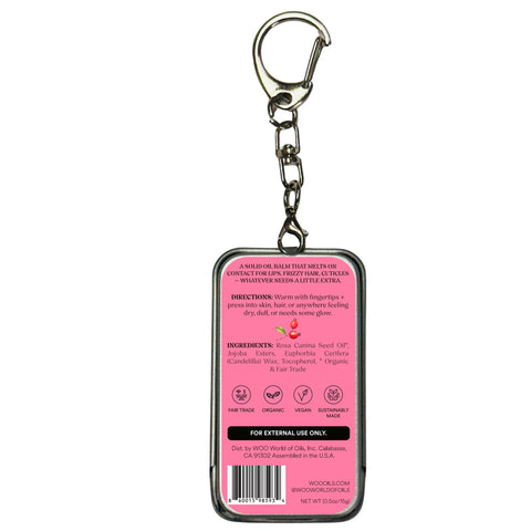 Pink-labeled solid oil balm keychain tin